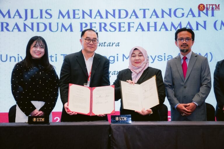 APulsar and Universiti Teknologi Malaysia (UTM) representatives holding a signed Memorandum of Understanding (MoU)
